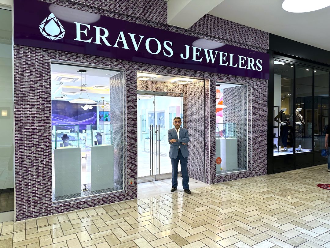 Photo of Ash Gupta (Founder of Eravos) in front of the Eravos's new location at Tysons Corner Center, McLean Virginia